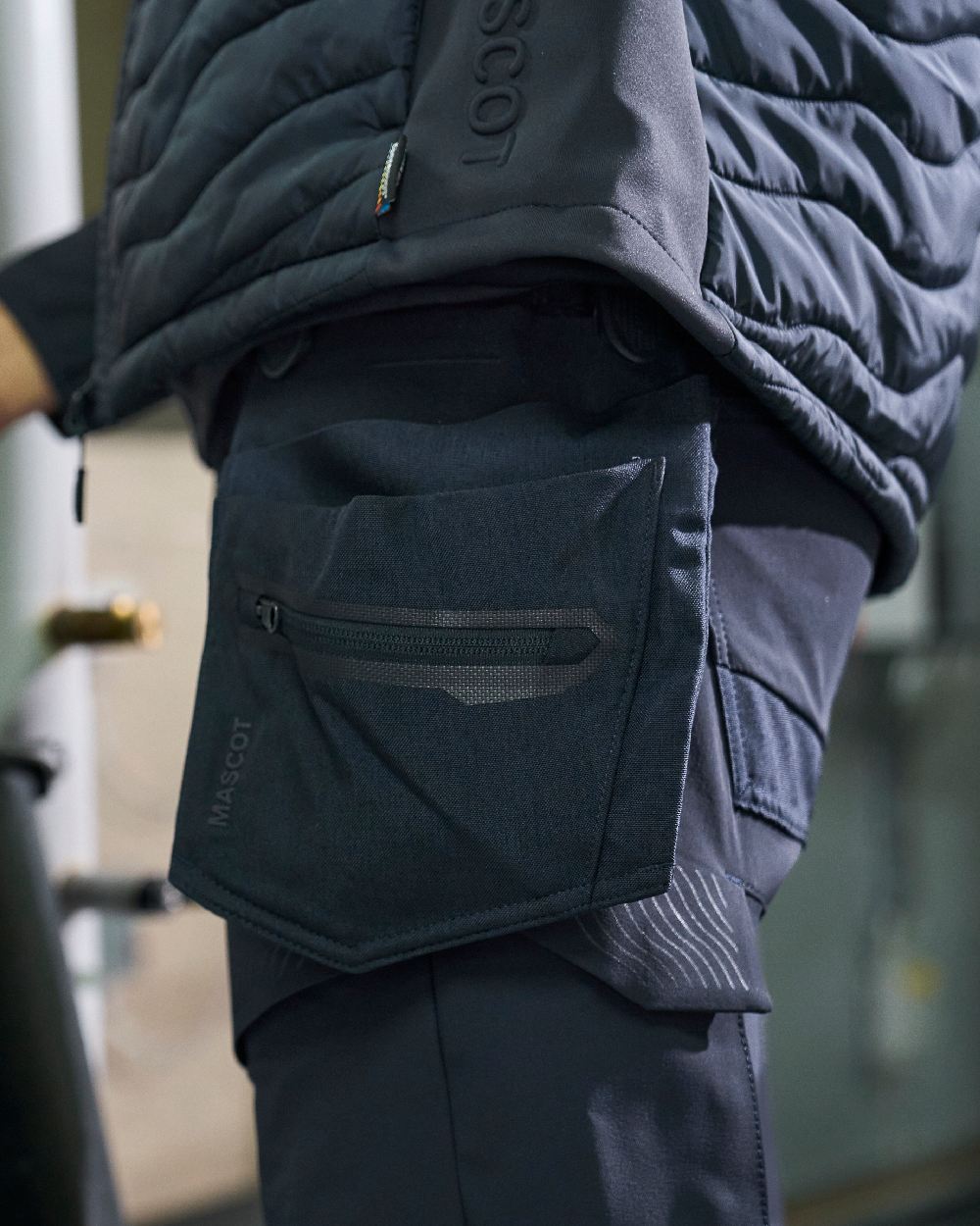 Black Coloured Mascot Workwear Customized Electrician Holster Pockets on construction background 
