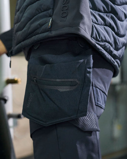 Black Coloured Mascot Workwear Customized Electrician Holster Pockets on construction background 