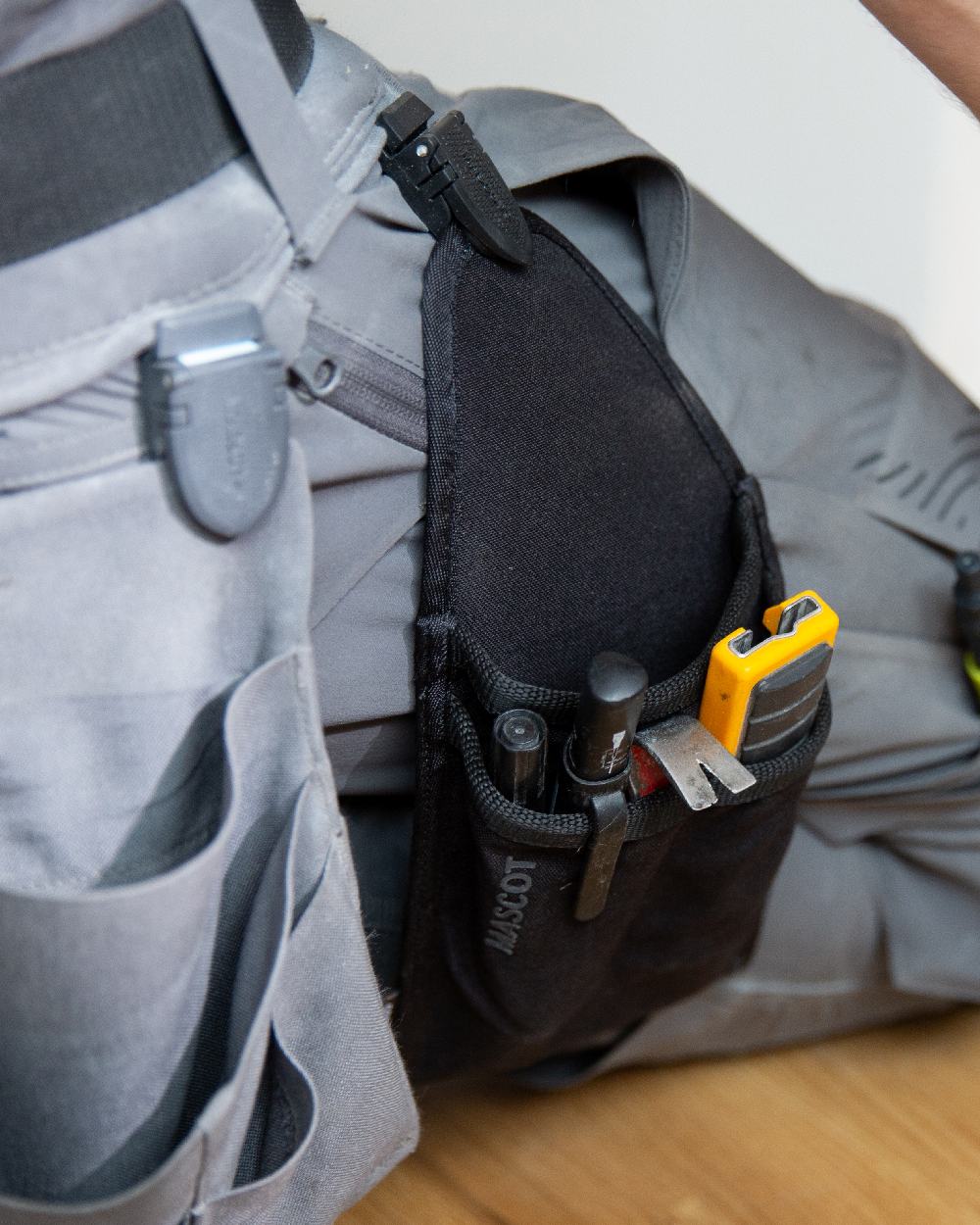 Black Coloured Mascot Workwear Customized Holster Pocket on outdoor background 