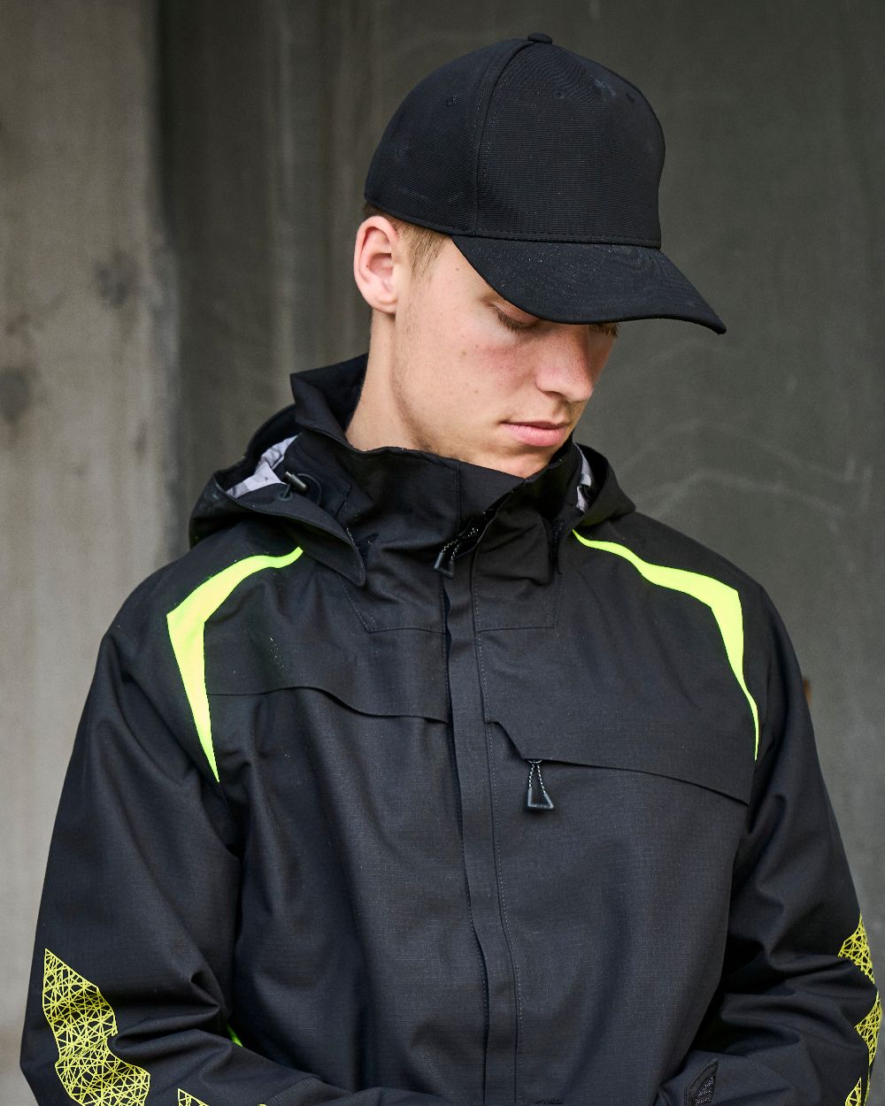 Black Coloured Mascot Workwear Customized Adjustable Cap on construction background 