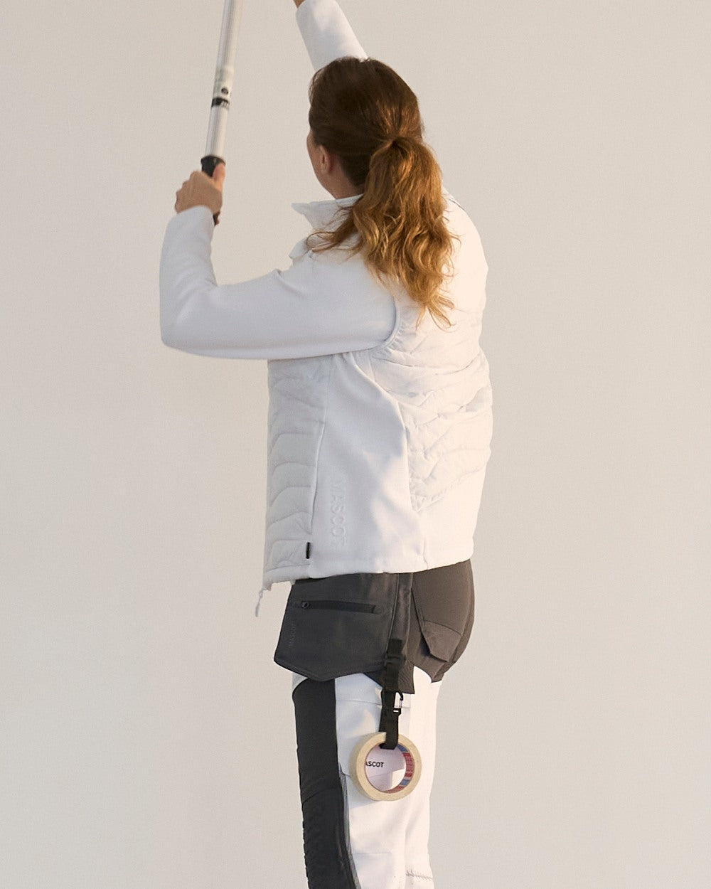 Stone Grey Coloured Mascot Workwear Customized Set of Two Painter Holster Pockets on indoor background 