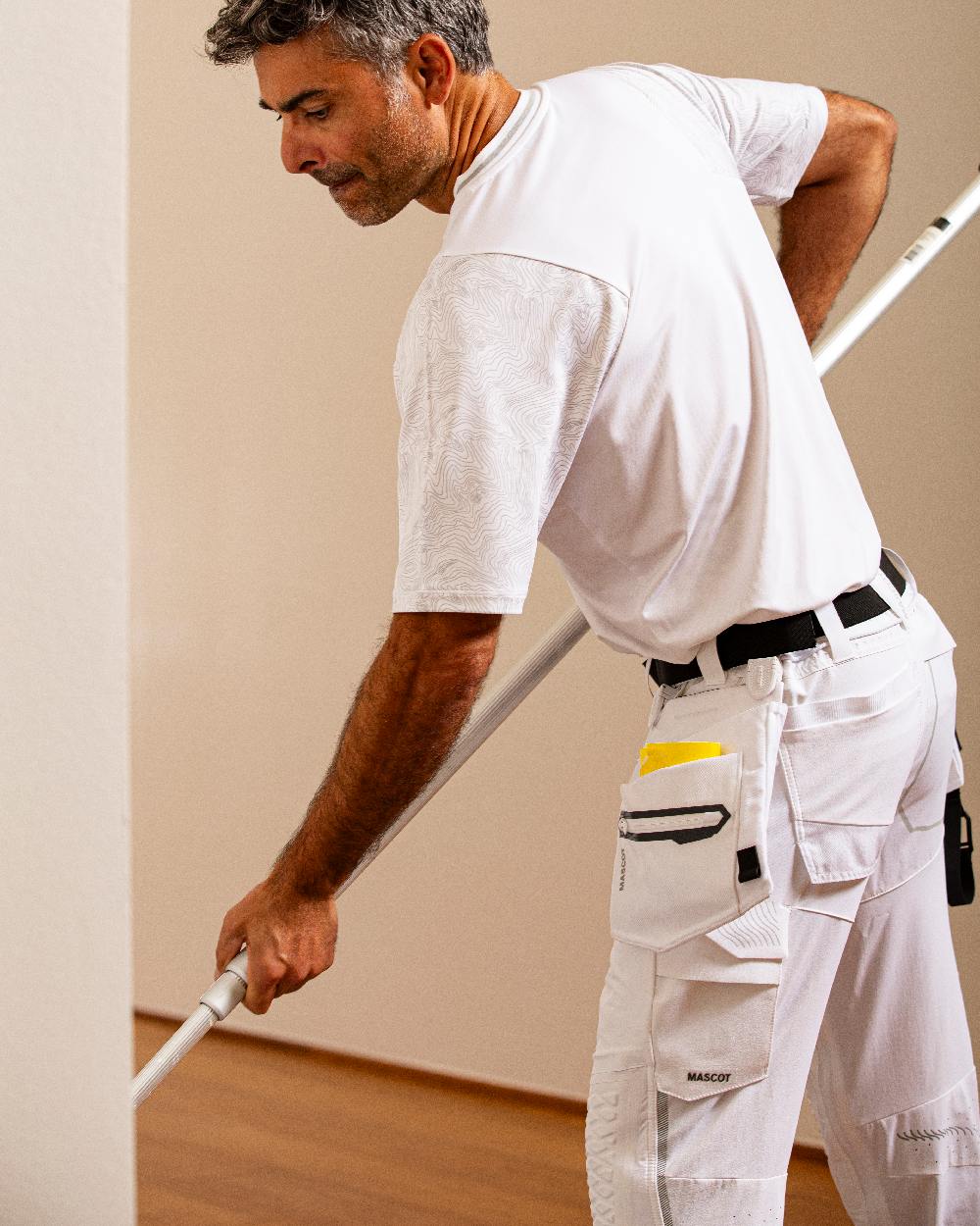 White Coloured Mascot Workwear Customized Set of Two Painter Holster Pockets on indoor background 