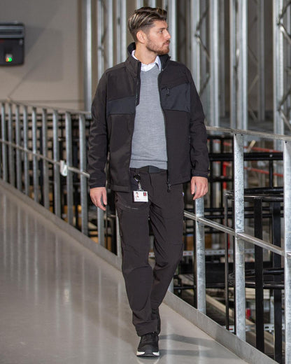 Black Coloured Mascot Workwear Mens Accelerate Breathable Softshell Jacket on factory background 