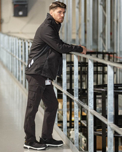 Black Coloured Mascot Workwear Mens Accelerate Breathable Softshell Jacket on factory background 