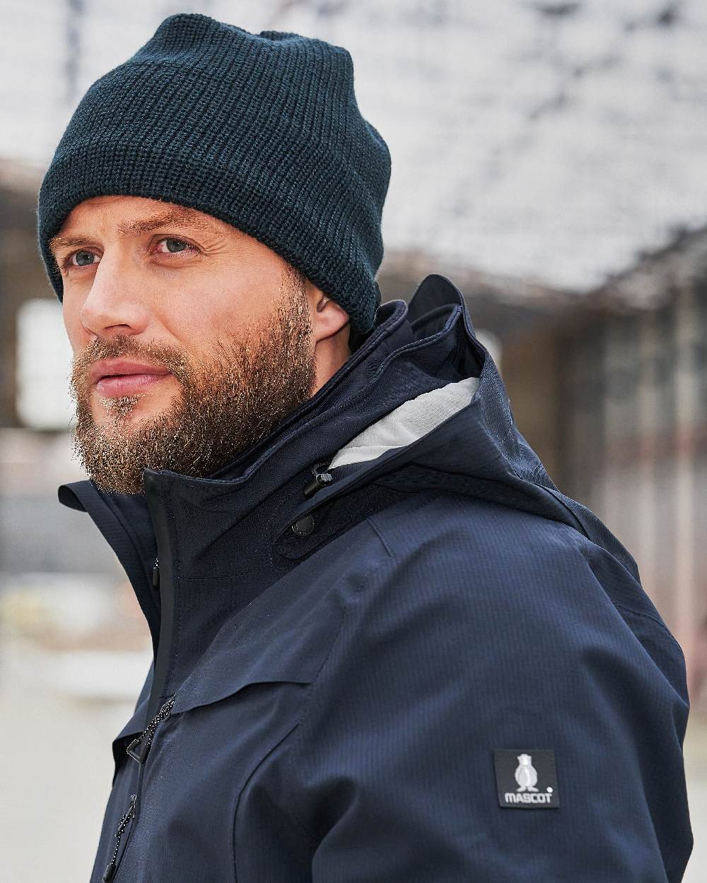Dark Navy Coloured Mascot Workwear Mens Accelerate Breathable Winter Jacket on outdoor background 