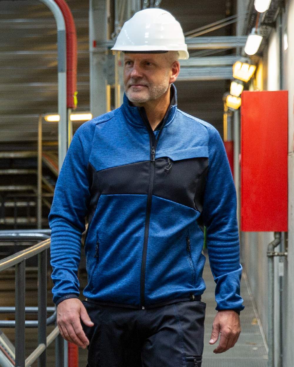 Azure Blue Dark Navy Coloured Mascot Workwear Mens Accelerate Fleece Jumper With Zipper on factory background 