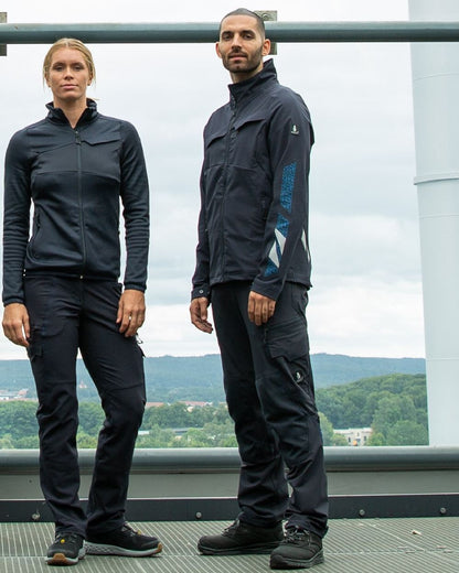 Dark Navy Coloured Mascot Workwear Mens Accelerate Lightweight Jacket on factory background 