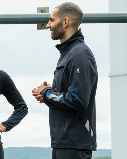 Dark Navy Coloured Mascot Workwear Mens Accelerate Lightweight Jacket on factory background 