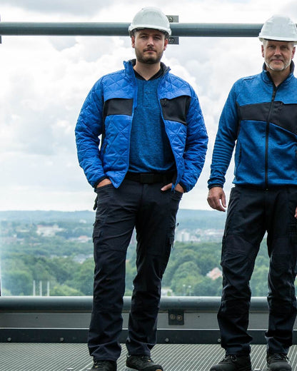 Azure Blue Dark Navy Coloured Mascot Workwear Mens Accelerate Lightweight Thermal Jacket on indoor background 