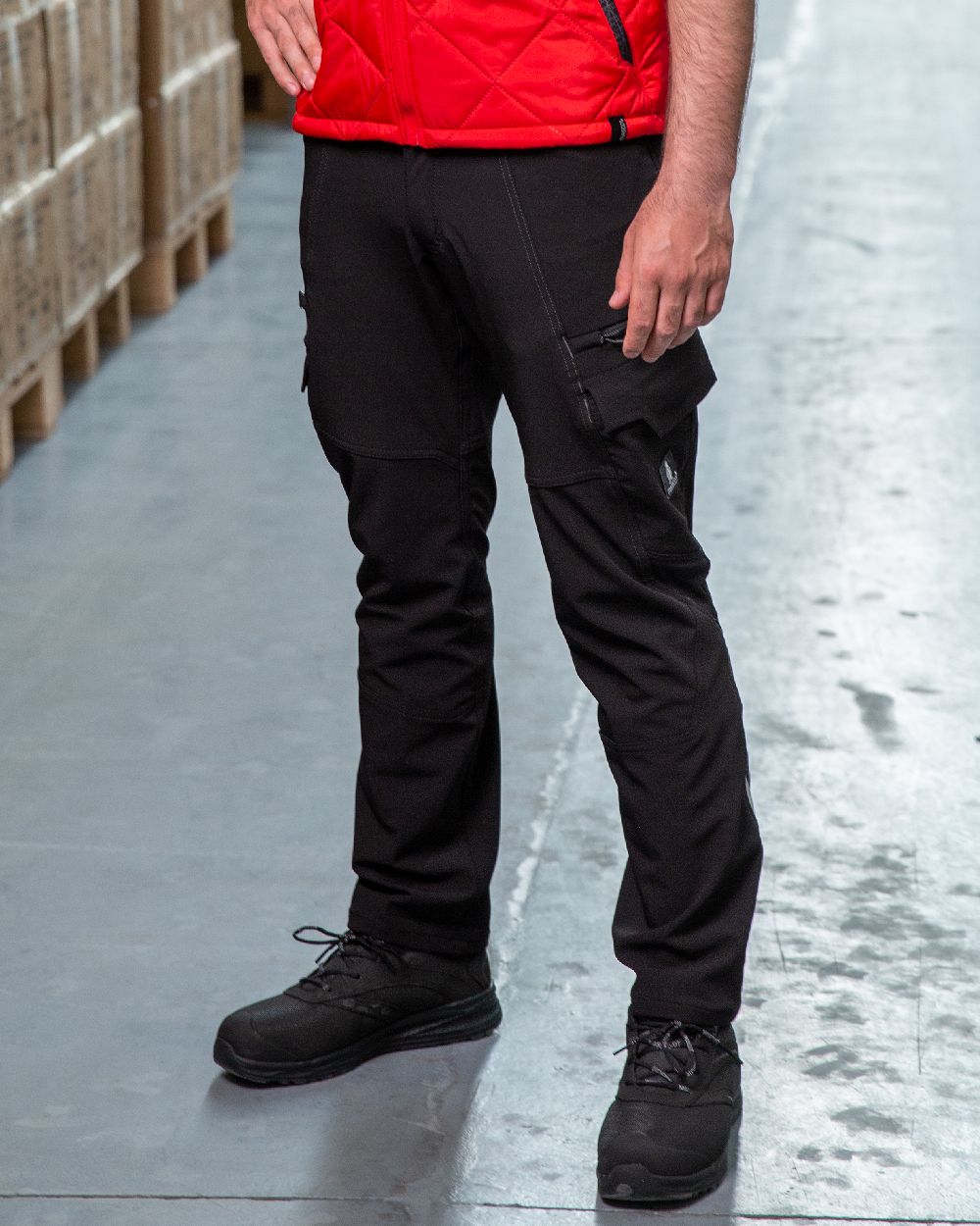 Black Coloured Mascot Workwear Mens Accelerate Lightweight Trousers With Thigh Pockets on warehouse background 