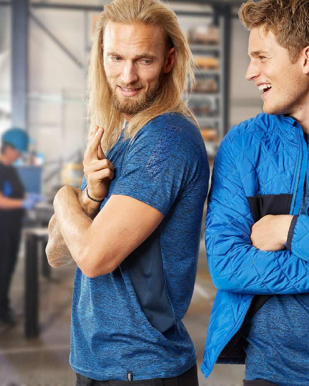 Azure Blue Dark Navy Coloured Mascot Workwear Mens Accelerate Polo Shirt on factory background 