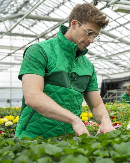 Grass Green Colored Mascot Workwear Mens Accelerate Short Sleeve T-Shirt on farm background 