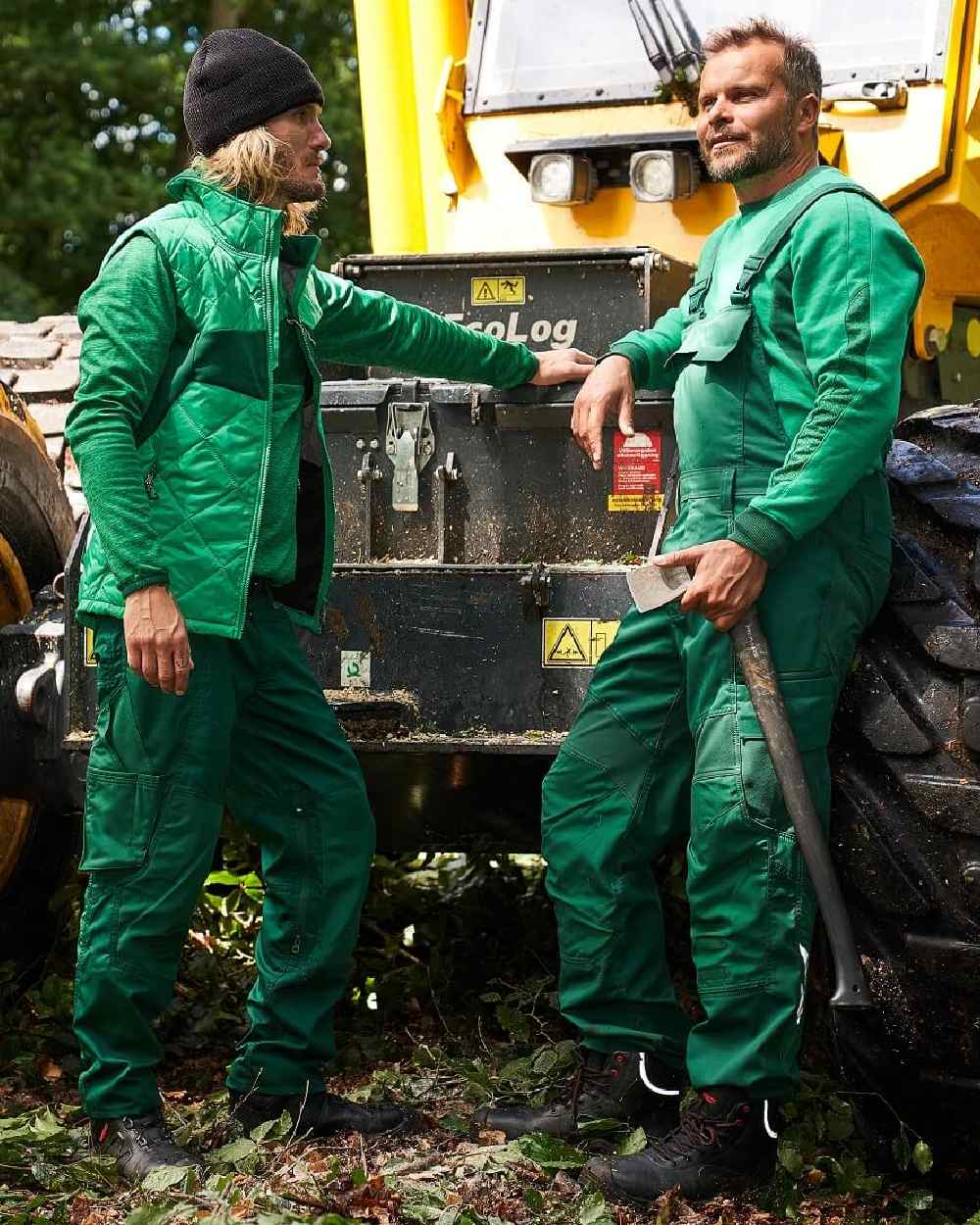 Green Coloured Mascot Workwear Mens Accelerate Stretch Zones Bib &amp; Brace With Kneepad Pockets on outdoor background 