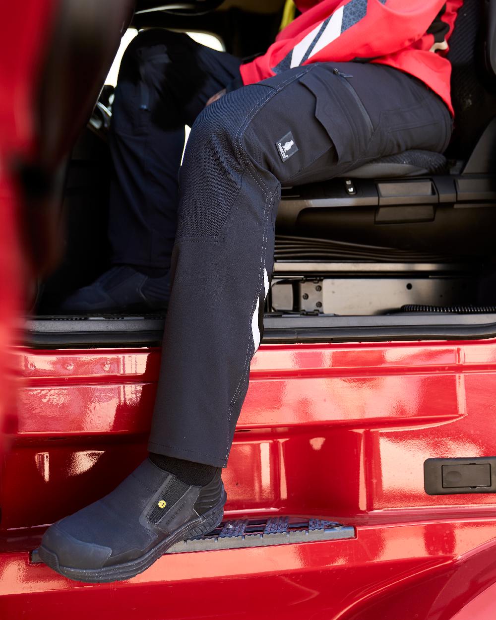 Black Coloured Mascot Workwear Mens Accelerate Ultimate Stretch Lightweight Trousers on outdoor background 