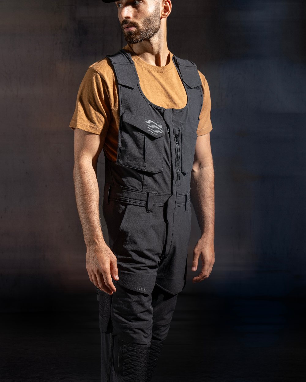 Black Coloured Mascot Workwear Mens Customized Combi Suit With Kneepad Pockets on studio background 