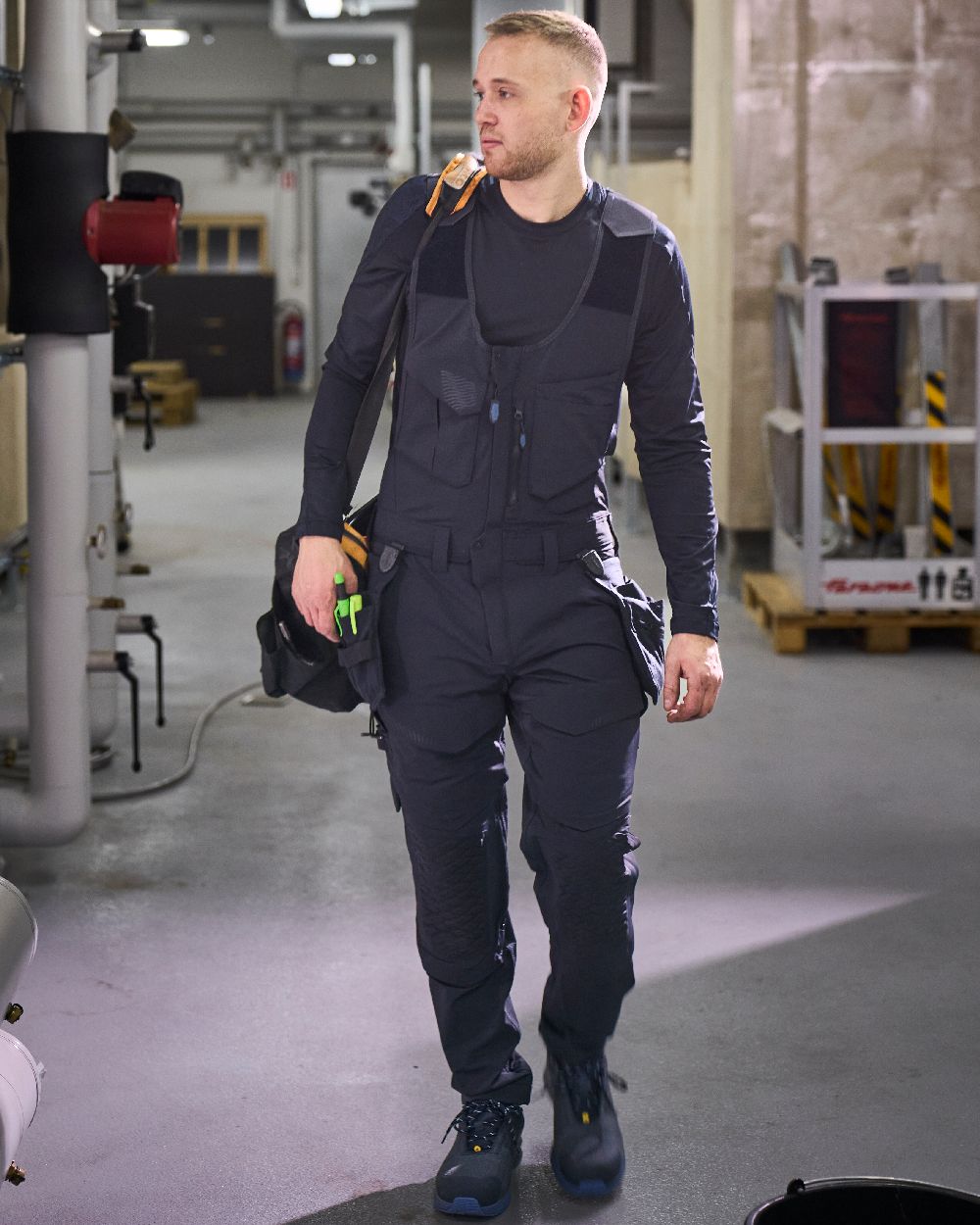 Dark Navy Coloured Mascot Workwear Mens Customized Combi Suit With Kneepad Pockets on factory background 