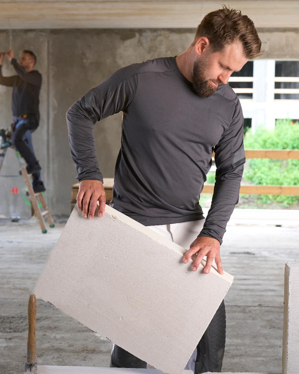 Stone Grey Coloured Mascot Workwear Mens Customized Long Sleeve T-Shirt on construction background 