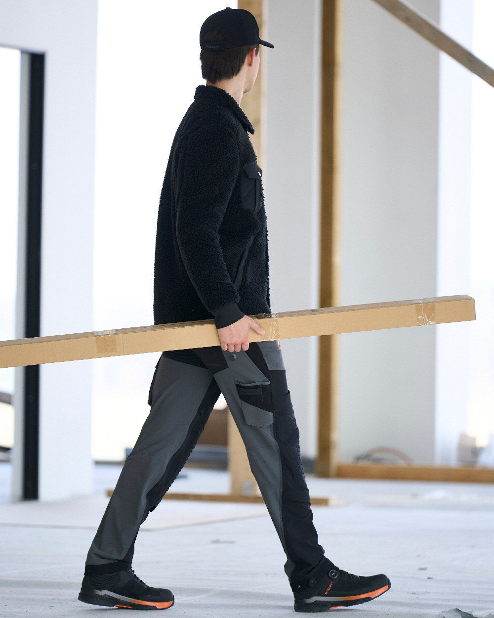 Black Coloured Mascot Workwear Mens Customized Pile Shirt on construction background 