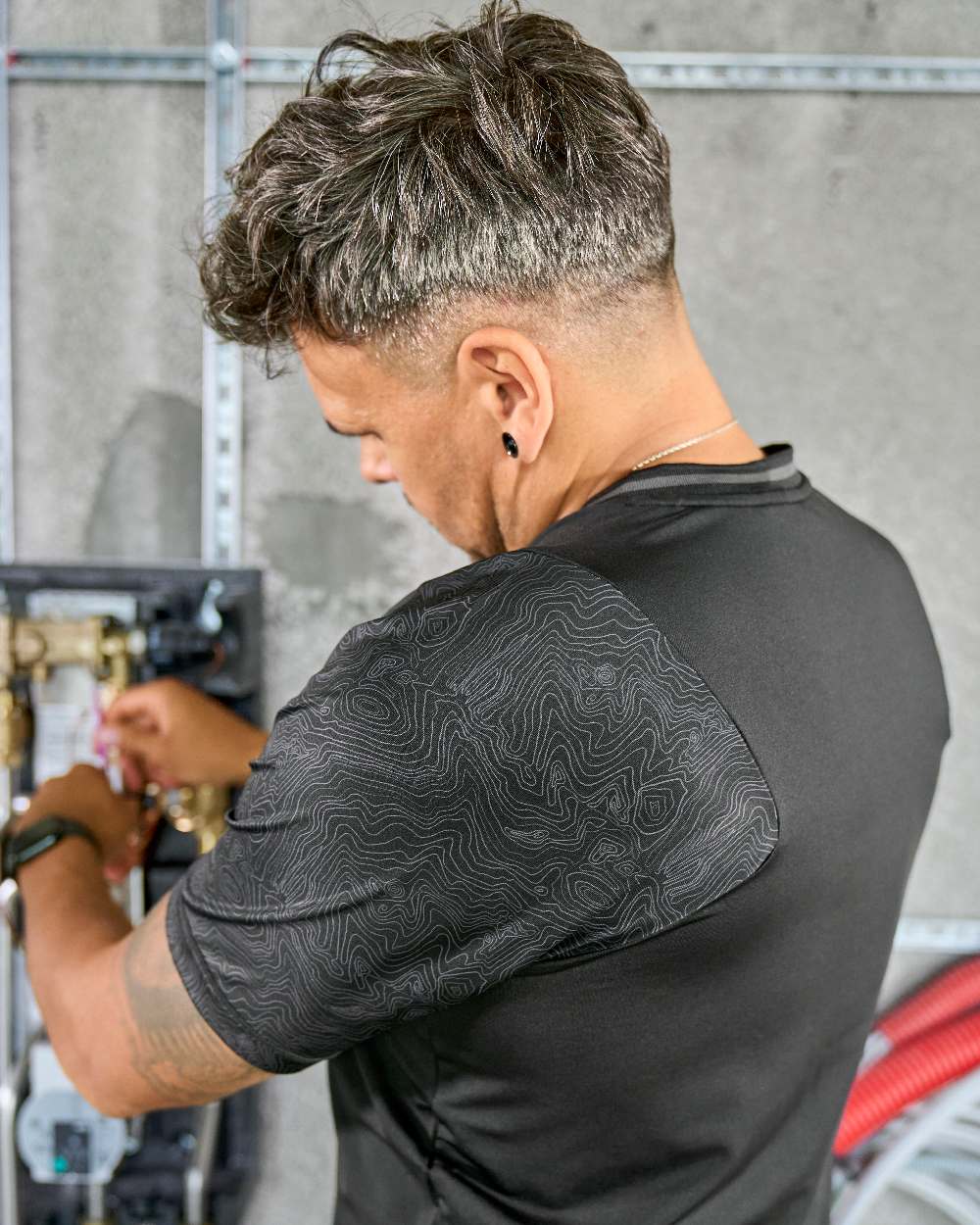 Black Coloured Mascot Workwear Mens Customized Short Sleeve T-Shirt on construction background 