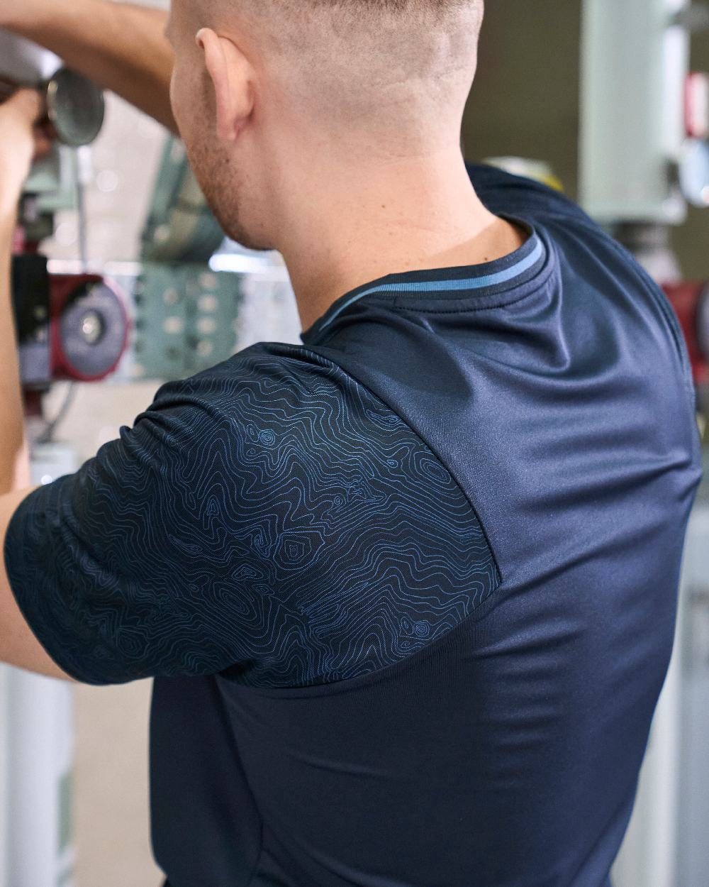 Dark Navy Coloured Mascot Workwear Mens Customized Short Sleeve T-Shirt on construction background 