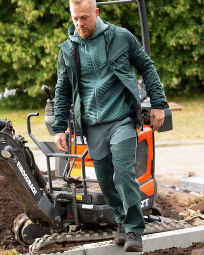Light Forest Green Coloured Mascot Workwear Mens Customized Ultimate Stretch Trousers on outdoor background 