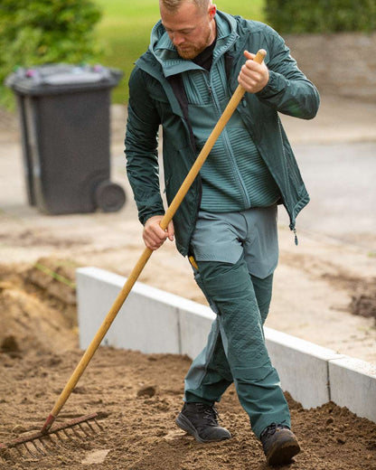Light Forest Green Coloured Mascot Workwear Mens Customized Ultimate Stretch Trousers on outdoor background 