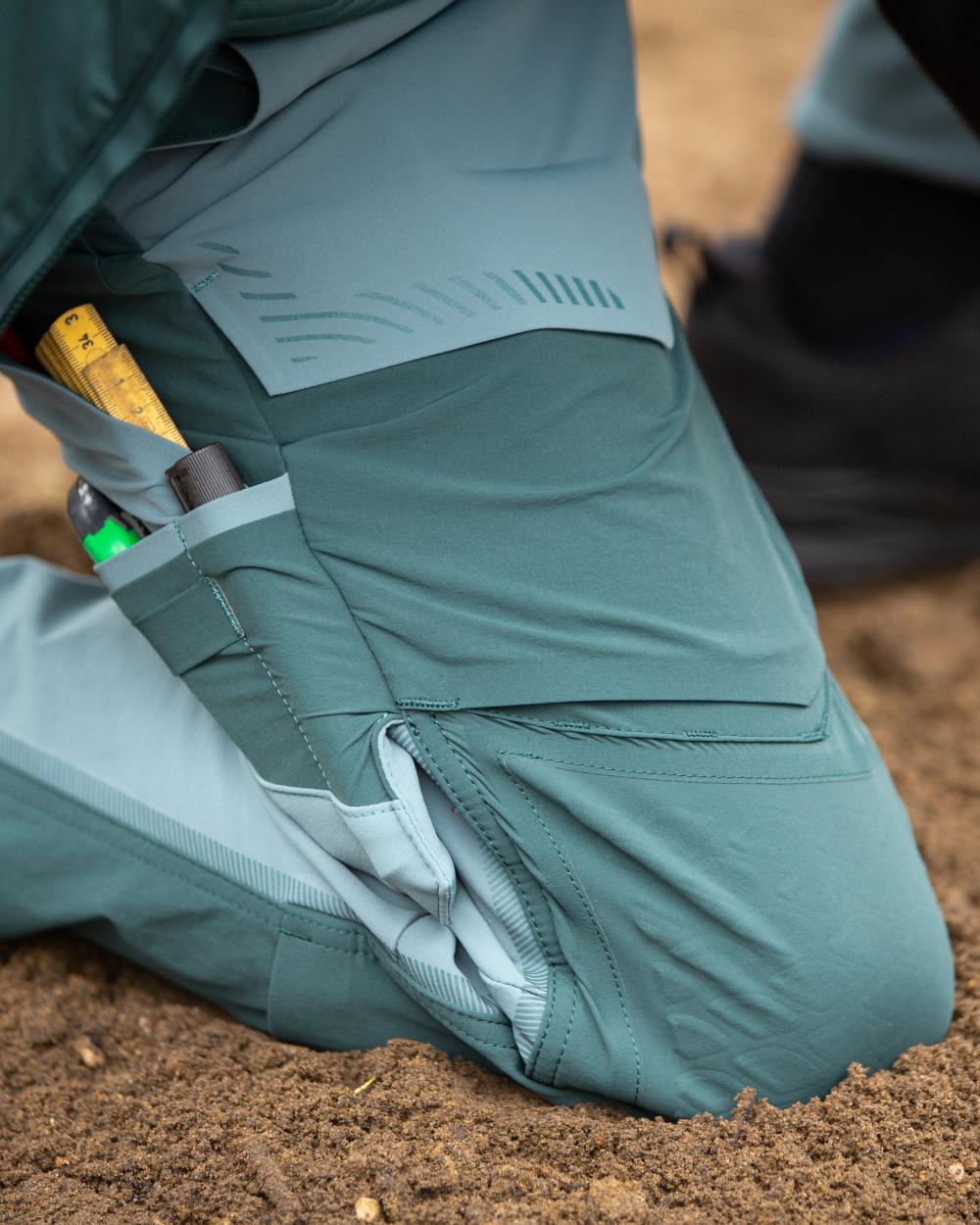 Light Forest Green Coloured Mascot Workwear Mens Customized Ultimate Stretch Trousers on outdoor background 