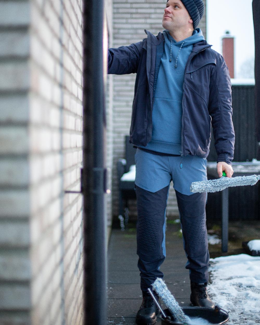 Stone Blue Dark Navy Coloured Mascot Workwear Mens Customized Ultimate Stretch Trousers on construction background 