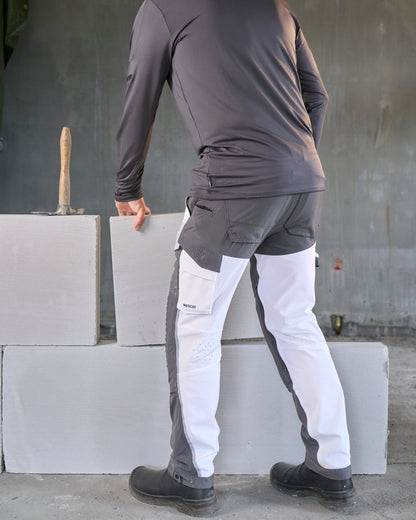 White Stone Grey Coloured Mascot Workwear Mens Customized Ultimate Stretch Trousers on construction background 