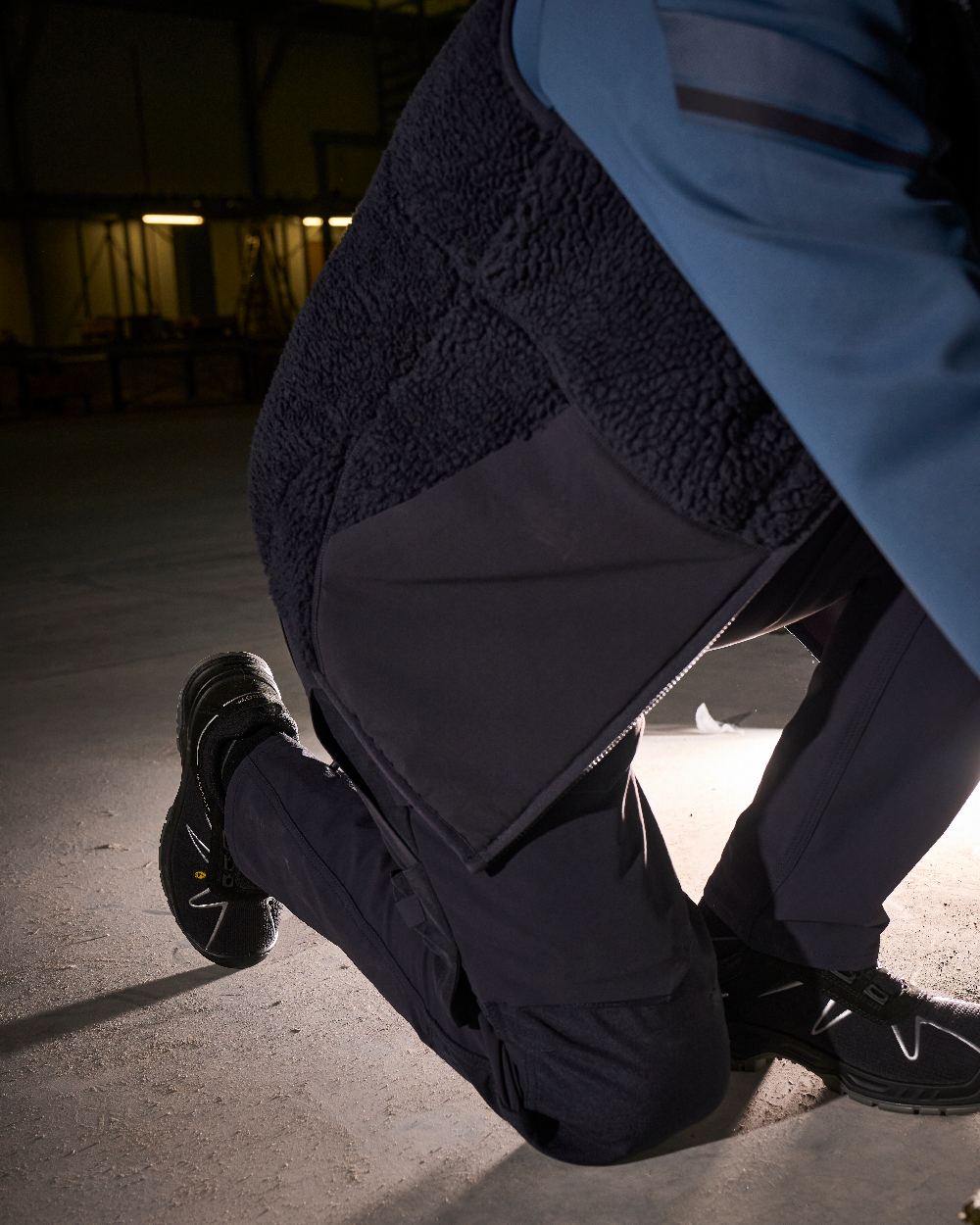 Black Coloured Mascot Workwear Mens Customized Ultimate Stretch Trousers With Kneepad Pockets on indoor background 