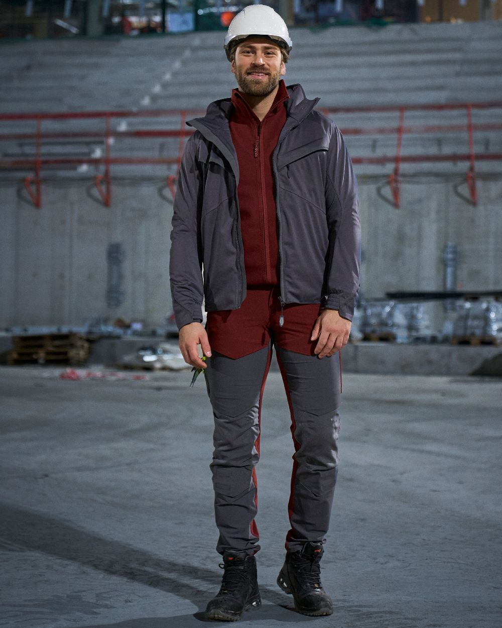Bordeaux Stone Grey Coloured Mascot Workwear Mens Customized Ultimate Stretch Trousers With Kneepad Pockets on construction background 