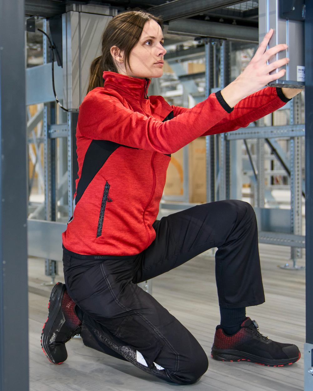 Traffic Red Black Coloured Mascot Workwear Womens Accelerate Fleece Jumper With Zipper on warehouse background 