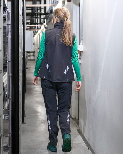 Black Coloured Mascot Workwear Womens Accelerate Gilet on factory background 