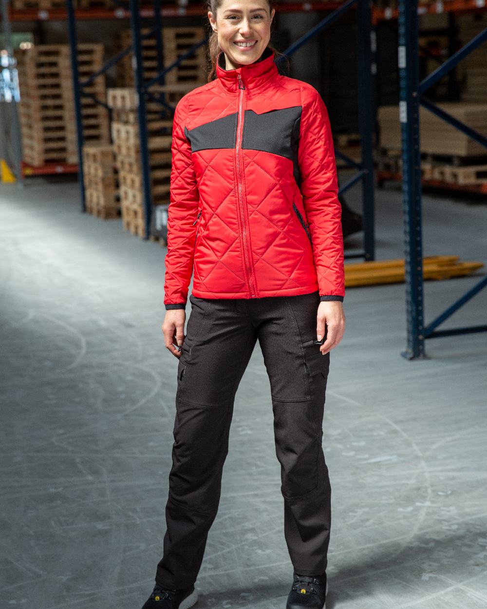Black Coloured Mascot Workwear Womens Accelerate Trousers With Thigh Pockets on warehouse background 