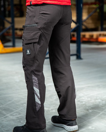 Black Coloured Mascot Workwear Womens Accelerate Trousers With Thigh Pockets on warehouse background 