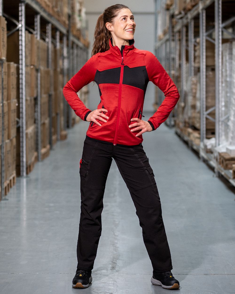 Black Coloured Mascot Workwear Womens Accelerate Ultimate Stretch Trousers on warehouse background 