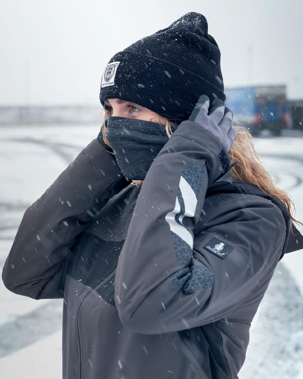 Dark Anthracite Black Coloured Mascot Workwear Womens Accelerate Waterproof Winter Jacket on snow background 