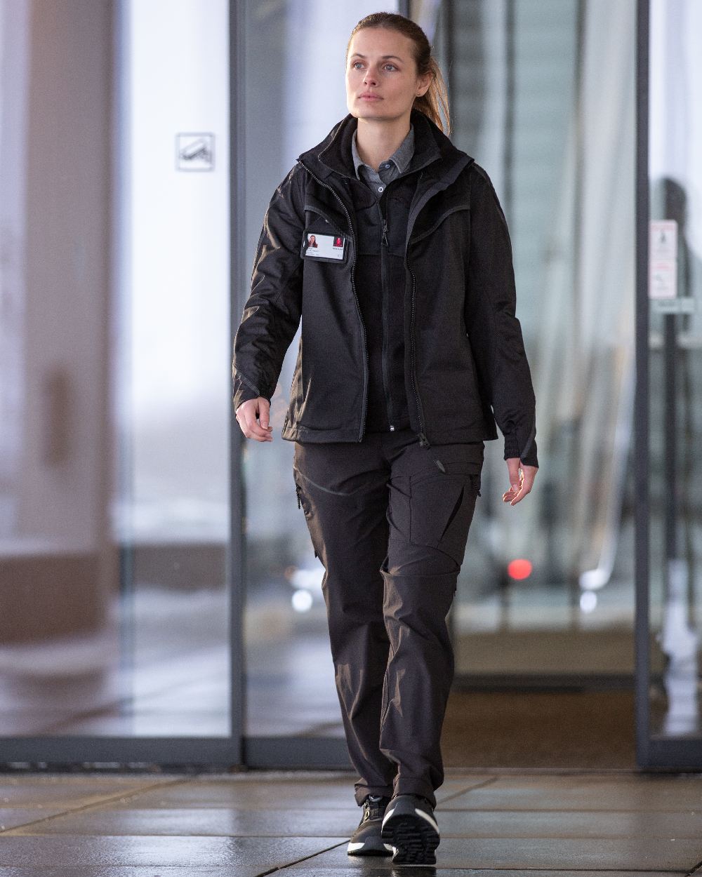 Black Coloured Mascot Workwear Womens Customized Outer Shell Jacket on office background 