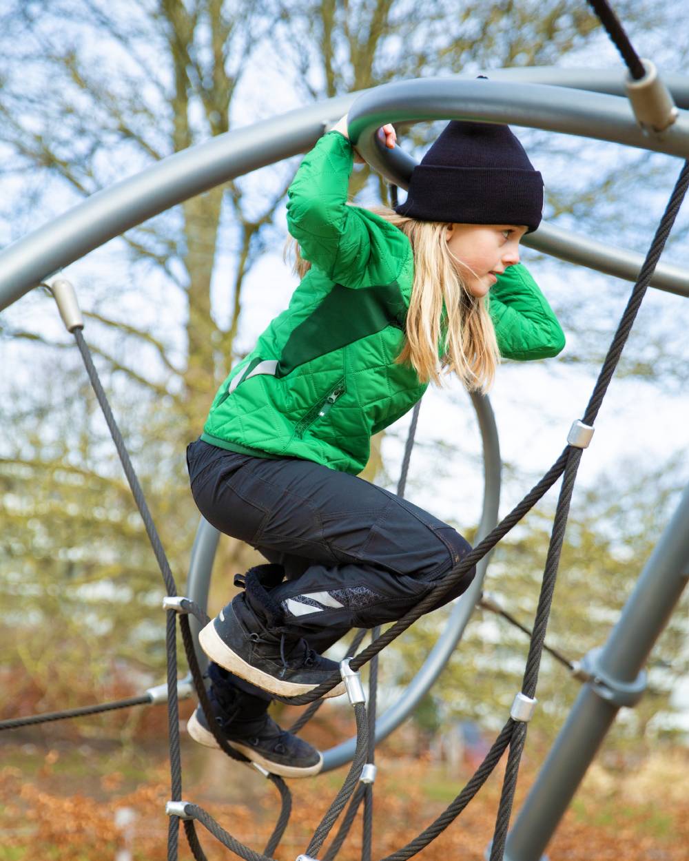 Black coloured Mascot Workwear Childrens Accelerate Pants on park background 