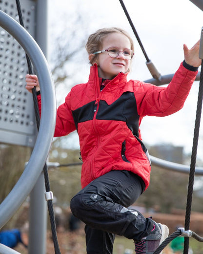 Traffic Red Black coloured Mascot Workwear Childrens Accelerate Water Repellent Jacket on park background 