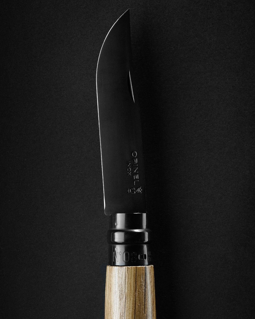 Black coloured Opinel No.8 Black Oak Knife on black background 