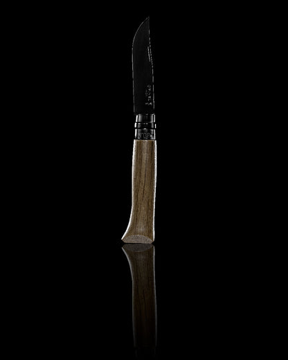 Black coloured Opinel No.8 Black Oak Knife on glossy background 