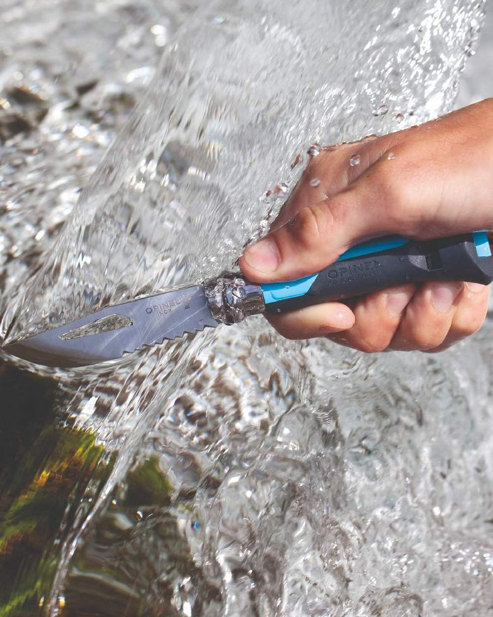 Blue coloured Opinel No.8 Outdoor Knife on water background 