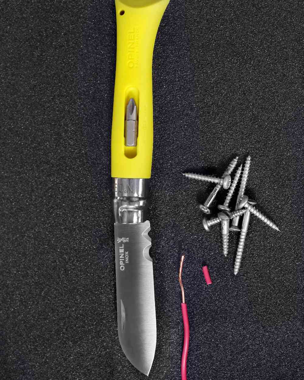 Yellow coloured Opinel No.9 DIY Knife on workstation background 