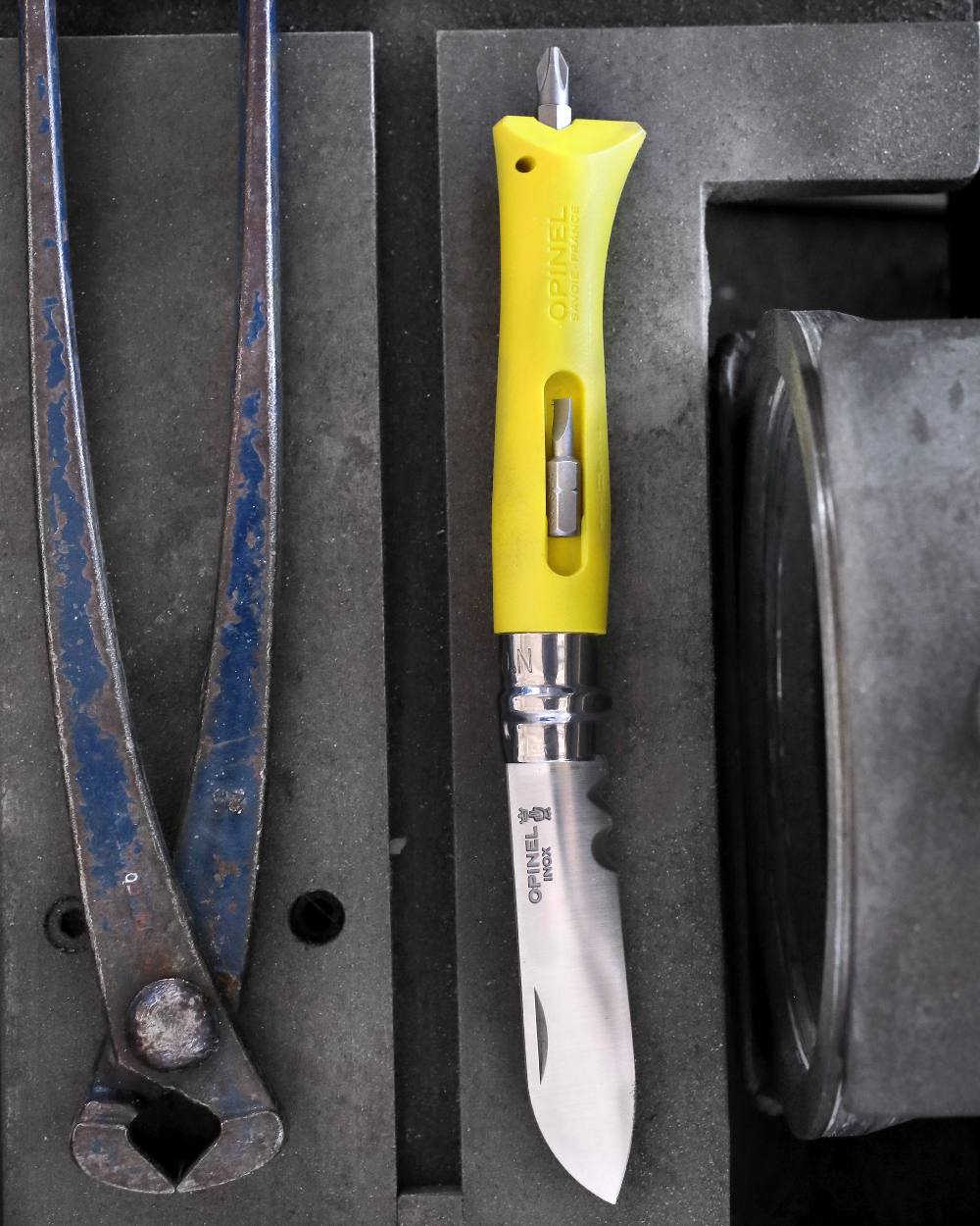 Yellow coloured Opinel No.9 DIY Knife on workstation background 