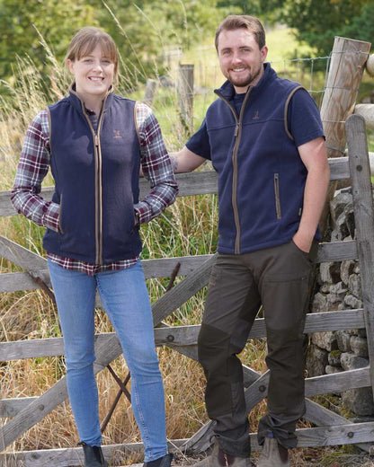 Navy coloured Percussion Scotland Fleece Gilet on farm background 