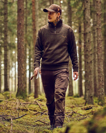 Dark Green Mel Coloured Pinewood Mens Hurricane Sweater on outdoor background 