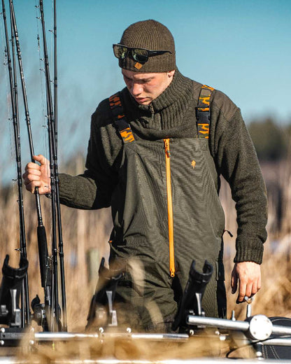 Dark Green Mel Coloured Pinewood Mens Hurricane Sweater on outdoor background 