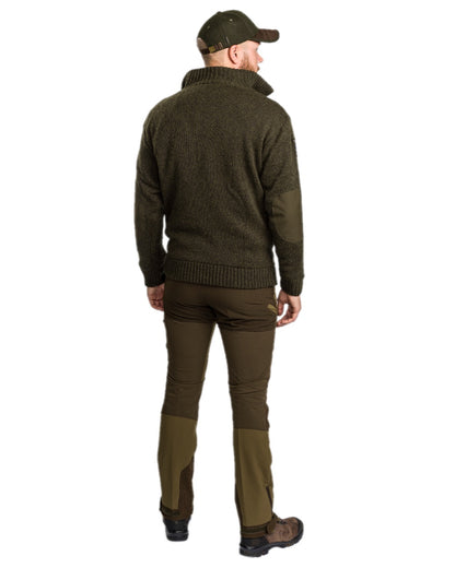 Dark Green Mel Coloured Pinewood Mens Hurricane Sweater on outdoor background 