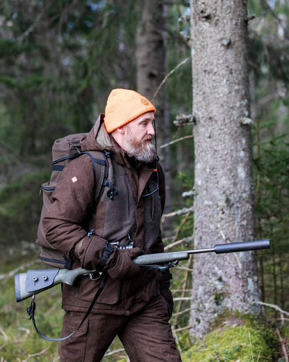 Suede Brown Coloured Pinewood Mens Smaland Abisko 2.0 Hunting Jacket on forest background 